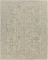 Close-up of the Dubbo Area Rug. Beige, charcoal, and seafoam hand-loomed rug with a traditional bohemian pattern. Design-Rectangle-810