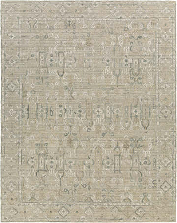 Close-up of the Dubbo Area Rug. Beige, charcoal, and seafoam hand-loomed rug with a traditional bohemian pattern. Design-Rectangle-810