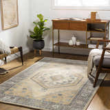 Living room scene with a Duckenfield Area Rug, wood floors, console table, fiddle leaf fig, and neutral decor. Roomscene-Rectangle