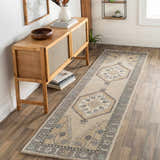 Hallway scene with a Bohemian Duckenfield Area Rug runner in beige, gray, and blue. Wooden console table and decor. Roomscene-Runner