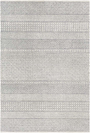 Close-up of the Dugway Tufted Maroc Wool Rug. Features a geometric Moroccan pattern in light beige, oatmeal, and charcoal. Design-Rectangle-576
