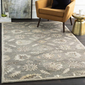 Living room scene with a floral Dulles Area Rug in gray, tan, and beige tones. Mustard chair and gold side table. Roomscene-Rectangle
