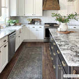 Farmhouse kitchen with a Greenpoint Dusty Blue Washable Rug runner on dark wood floors. White cabinets and granite countertops. Roomscene-Runner