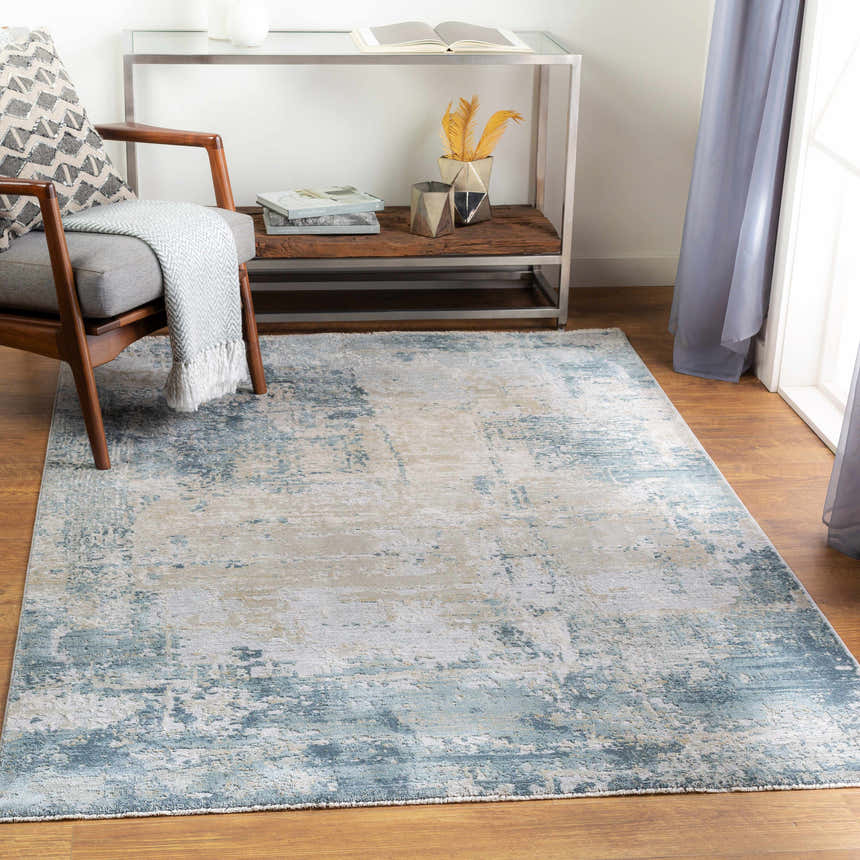 Living room scene with a blue and beige Devonport Thick Luxe Area Rug, wood chair, and console table. Roomscene-Rectangle