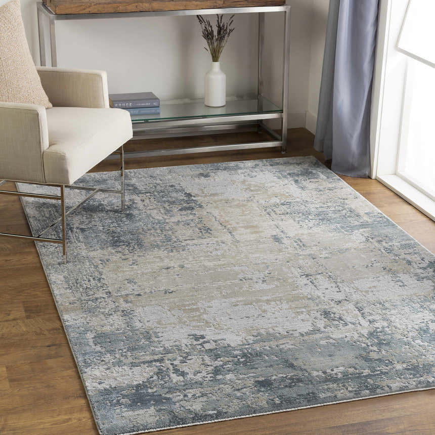 Living room scene with a Devonport Thick Luxe Area Rug in dusty sage, light gray, and taupe under a modern chair and console table. Roomscene-Rectangle