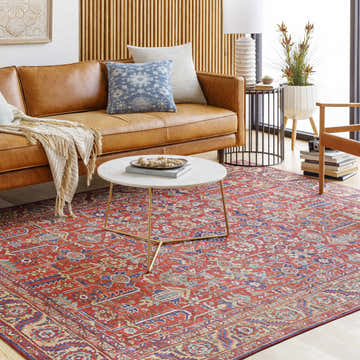 Living room scene with a brown leather sofa and the Edwardsburg Traditional Red Rug. Roomscene-Rectangle