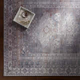 Close-up of the Baltinglass Gray Washable Rug showing its traditional oriental pattern, brown, charcoal, cream, and gray colors. Styleshot