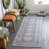 Entryway with Baltinglass Gray Washable Rug, brown bench, plants, and gray wood floors. Farmhouse style. Roomscene-Runner