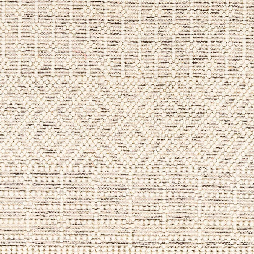 Close-up of the hand woven Egil Wool-blend Area Rug, showcasing its off white, black, and brown textured pattern. Texture