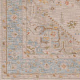 Close-up of the Ehan Cream Thick Luxe Oushak Rug, showcasing its traditional pattern, amber, blue, and taupe color palette. Swatch