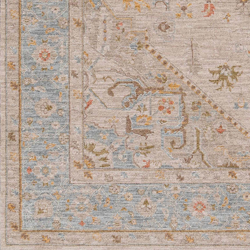Close-up of the Ehan Cream Thick Luxe Oushak Rug, showcasing its traditional pattern, amber, blue, and taupe color palette. Swatch