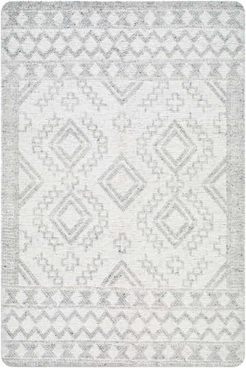 Close-up of the Elin Area Rug featuring a geometric diamond pattern in arctic stone and dark gray hues. Hand-woven texture. Design-Rectangle-576