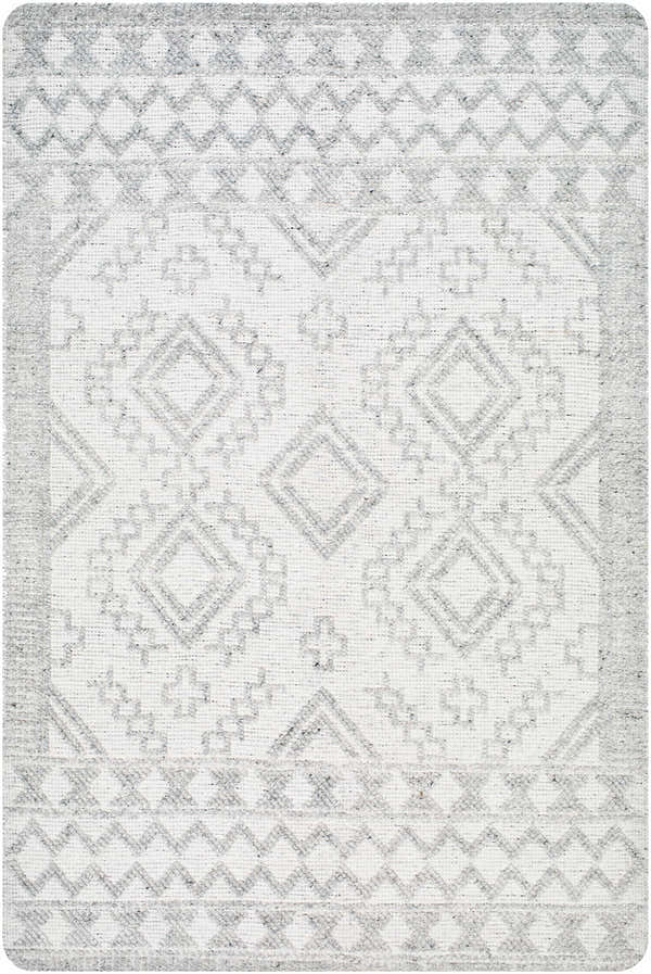 Close-up of the Elin Area Rug featuring a geometric diamond pattern in arctic stone and dark gray hues. Hand-woven texture. Design-Rectangle-576