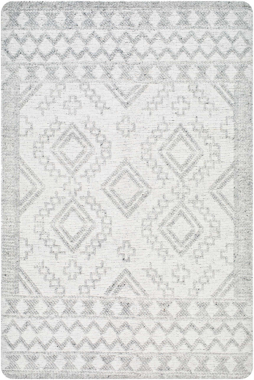 Close-up of the Elin Area Rug featuring a geometric diamond pattern in arctic stone and dark gray hues. Hand-woven texture. Design-Rectangle-576