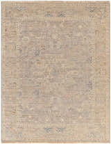 Close-up of the hand-knotted Ellie Area Rug. Beige, denim, and brown traditional rug with a farmhouse design and wool texture. Design-Rectangle-810
