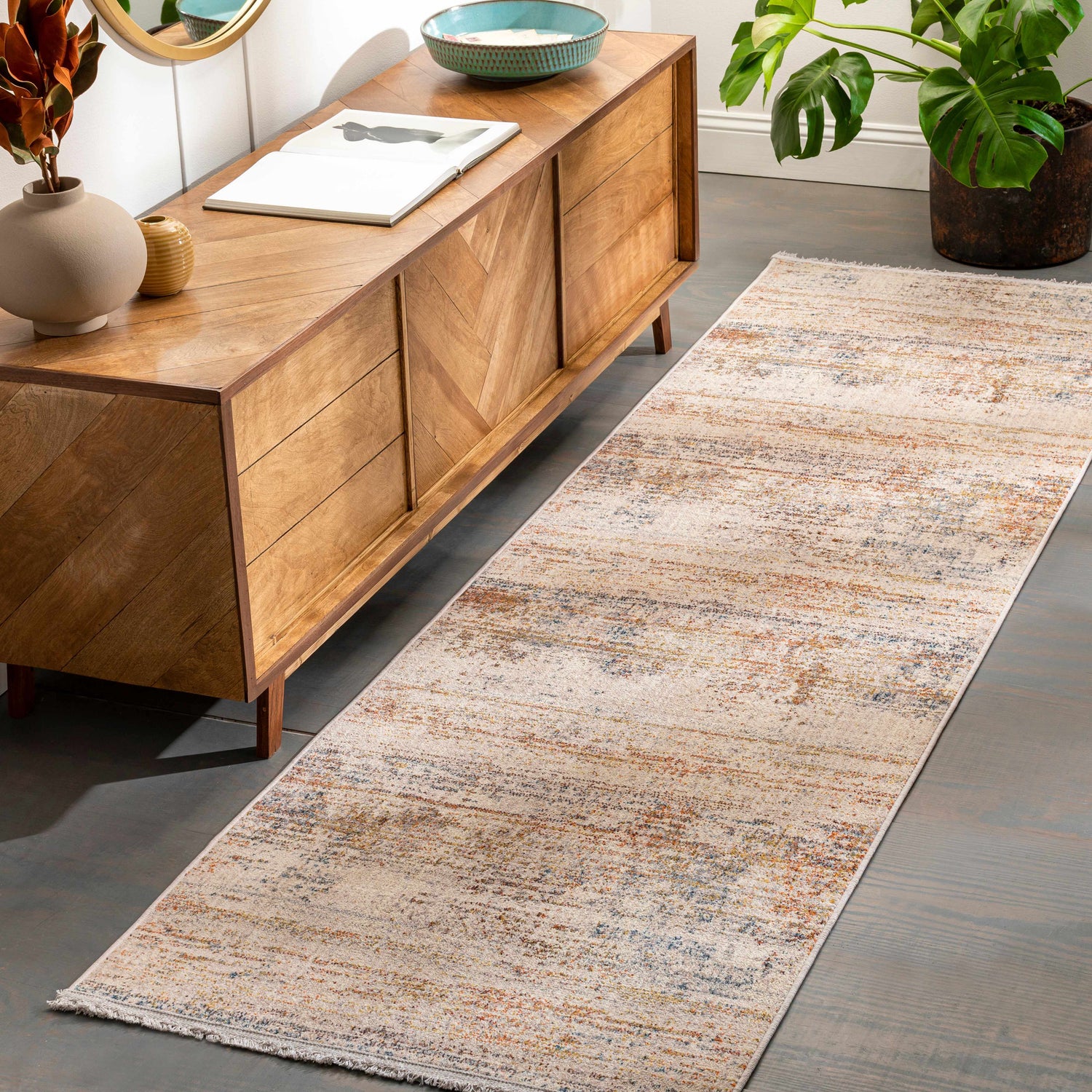 Eltingville Area Rug runner in entry. Contemporary rug with brick red, orange, blue, and gray tones. Roomscene-Runner