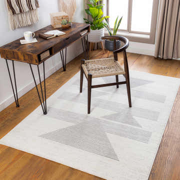 Home office with a wood desk and Emberton Area Rug in gray geometric pattern. Roomscene-Rectangle