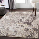 Entryway with Encinal Area Carpet in light beige, brown, and slate. Contemporary rug styled with pouf and chair. Roomscene-Rectangle