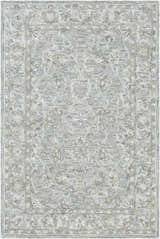 Close-up of the Eriline Wool & Faux Silk Rug. Features denim, ivory, sage, and taupe floral pattern. Hand-tufted texture. Design-Rectangle-576