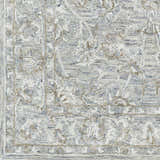 Close up of the Eriline Wool & Faux Silk Rug. Denim, ivory, sage, and taupe tones create an oriental pattern. Hand-tufted texture. Swatch