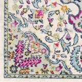 Close-up of the Errol Area Rug. Features a white base with aqua, pink, and yellow floral and paisley patterns. Swatch