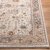 Close up of the Paatan Luxe Floral Oushaq Area Rug showing cream, gold, brown, and gray floral design and border. Front