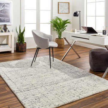 Bright home office with Estella Area Rug, white desk, gray chair, and wood floors. Roomscene-Rectangle