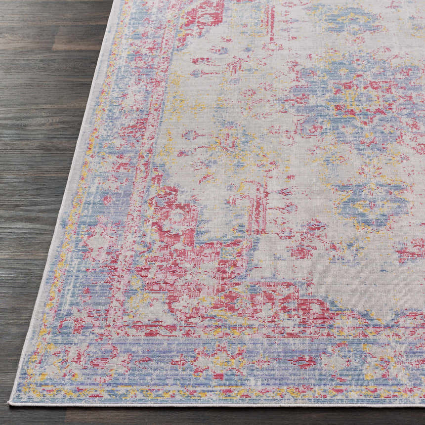 Close-up of the Eufaula Area Rug showing its traditional pattern in burgundy, gray, lavender, red, and yellow. Front