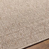 Close-up of the Maunawili Cream Nordic Rug showing the woven texture and geometric pattern in beige and light brown tones. Texture