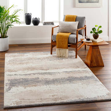 Living room scene with a beige and gray Ezell Abstract Thick Rug, chair, and wood floors. Roomscene-Rectangle