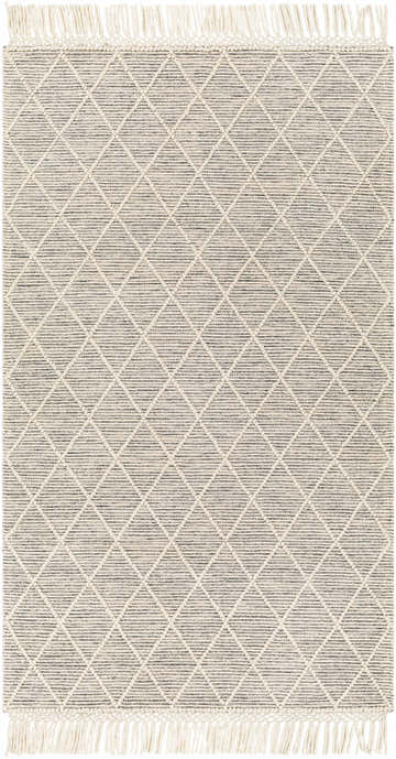 Close-up of Ezria Wool Rug with Tassels. Bone and dark gray rug features a geometric diamond pattern and tasseled edges. Design-Rectangle-58