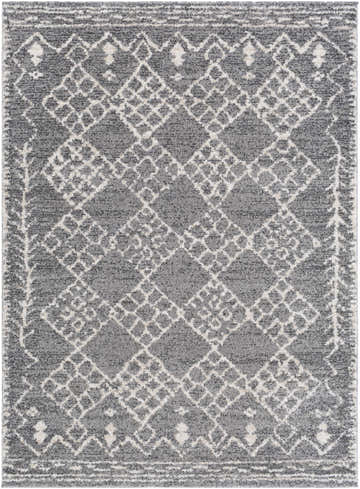 Close-up of the Fadden Area Rug, a machine-woven rug with a gray, charcoal, and off-white geometric diamond pattern. Design-Rectangle-5373