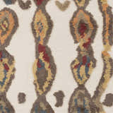 Close-up of the Brown Mustard Nila Carpet. Hand-woven wool shag rug with beige background and brown, mustard, and burgundy pattern. Swatch