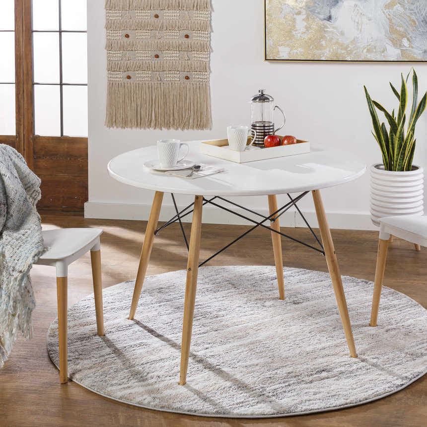 Dining room scene with round white table on gray and ivory Ferrelview Area Rug. Roomscene-Round