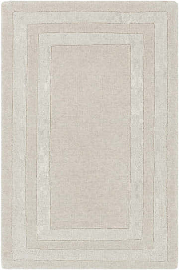 Close-up of the hand-tufted Ferrum Area Rug. Beige and taupe wool with a solid, striped pattern and soft texture. Design-Rectangle-23
