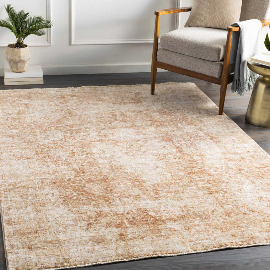 Living room scene with a neutral armchair and the brick red Fieldale Carpet adding a vintage, bohemian touch. Roomscene-Rectangle