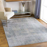Living room scene with Fallin Gray Thick Luxe Abstract Striped Rug, beige chair, and silver console table. Roomscene-Rectangle