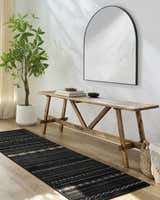 Entryway with wood bench, mirror, and a Fogertown Black Western Rug runner on a light wood floor. Roomscene-Runner