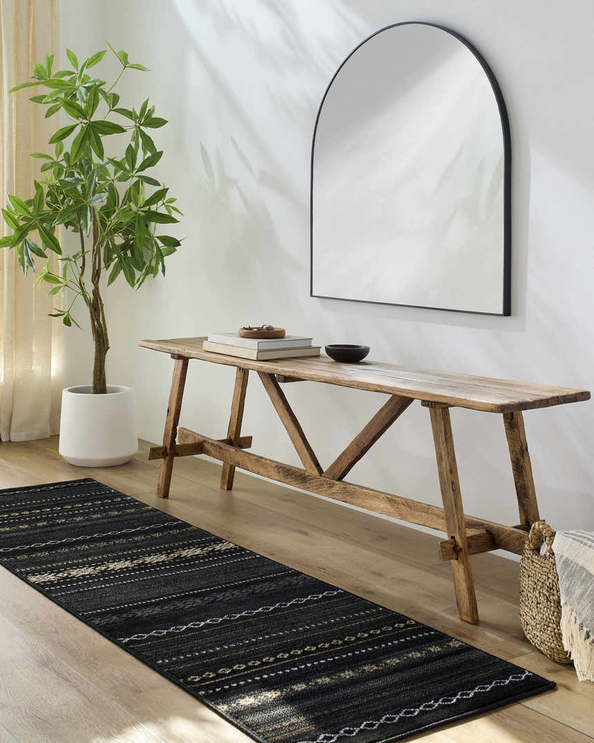 Entryway with wood bench, mirror, and a Fogertown Black Western Rug runner on a light wood floor. Roomscene-Runner