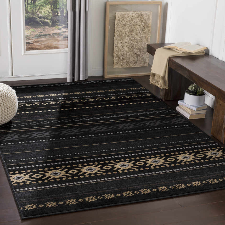 Entryway with a Fogertown Black Western Rug, dark wood floors, bench, and neutral accents. Roomscene-Rectangle