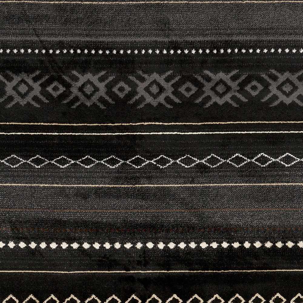 Close-up of Fogertown Black Western Rug. Southwestern pattern with charcoal, gray, and beige geometric designs on a black background. Swatch