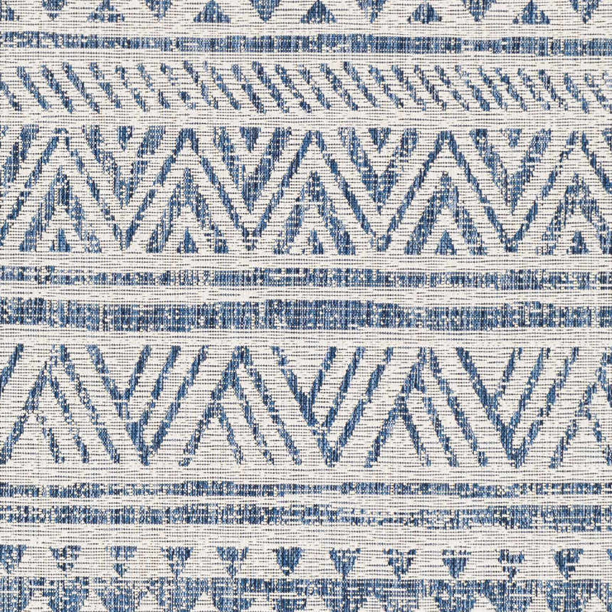 Close-up of the Novato Navy All Over Pattern Performance Rug. Blue and white geometric design. Swatch