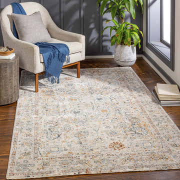 Living room scene with a Forth Luxe Rug, beige chair, wood side table, and potted plant near a window. Roomscene-Rectangle