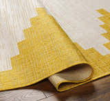 Close-up of Djugun Yellow Outdoor Rug showing geometric pattern, woven texture, and colors of beige, bone, and yellow. Fold
