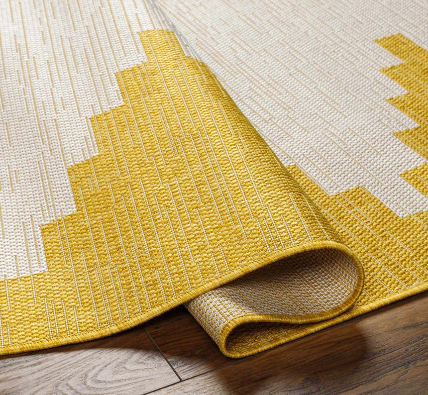 Close-up of Djugun Yellow Outdoor Rug showing geometric pattern, woven texture, and colors of beige, bone, and yellow. Fold
