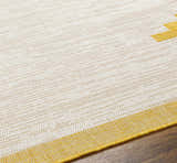 Close-up of Djugun Yellow Outdoor Rug showing beige, bone, and yellow geometric pattern and woven texture. Texture