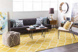 Living room scene with a mustard Bloomer Area Rug, gray sofa, and mid-century modern furniture. Bright, contemporary style. Roomscene-Rectangle