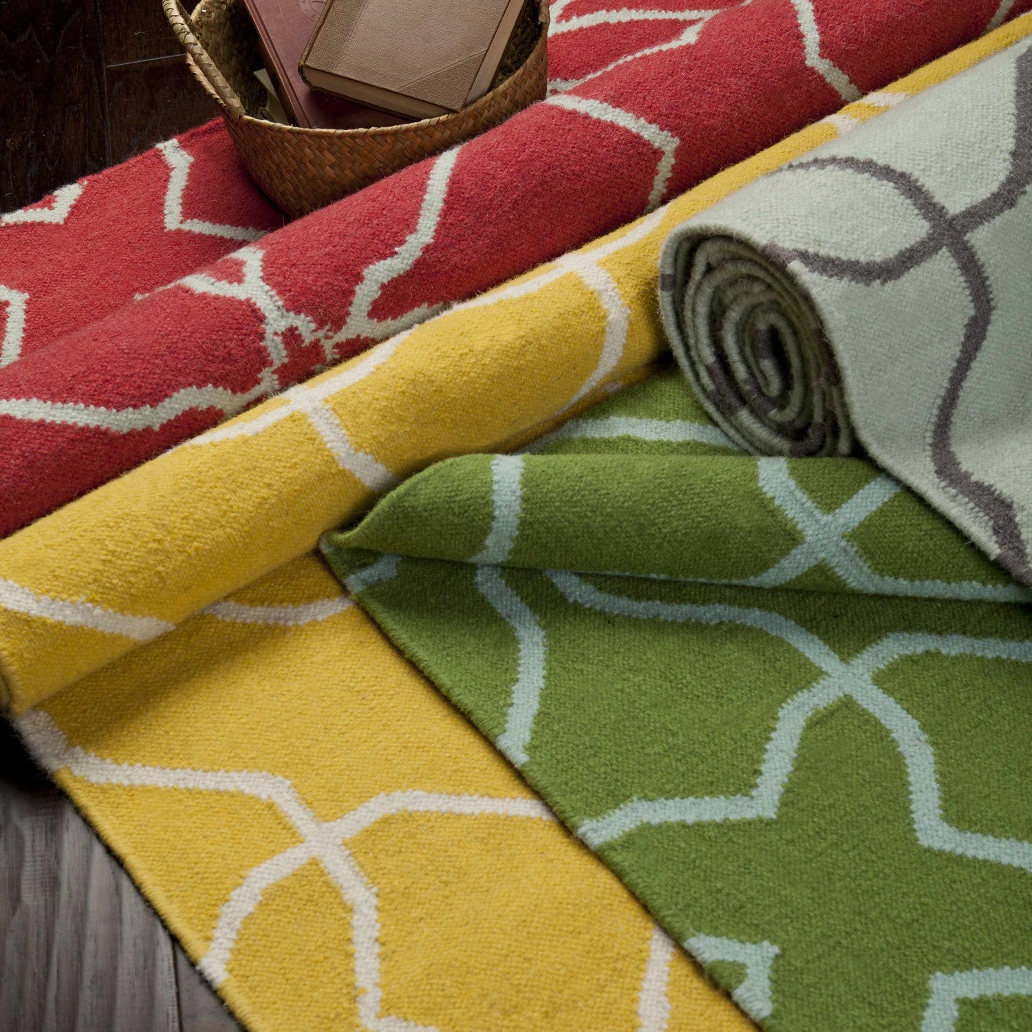 Rolled Creekside Area Rugs in red, yellow, green and light blue with geometric pattern. Hand woven wool texture. Styleshot
