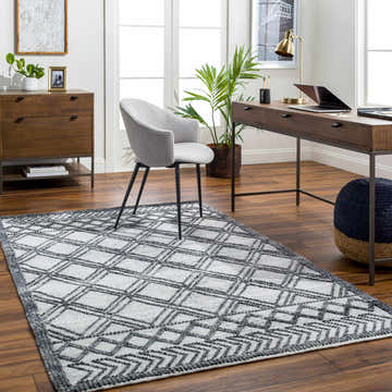 Home office with Gada Area Rug in dark gray and light gray, featuring a geometric diamond pattern. Roomscene-Rectangle