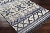 Close-up of Gakona High-Low Cream&Blue Wool Rug showing geometric pattern, cream shag accents, and dark blue details. Corner